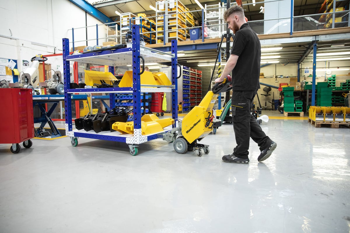 MasterMover electric tug moving a custom trolley in an industrial facility