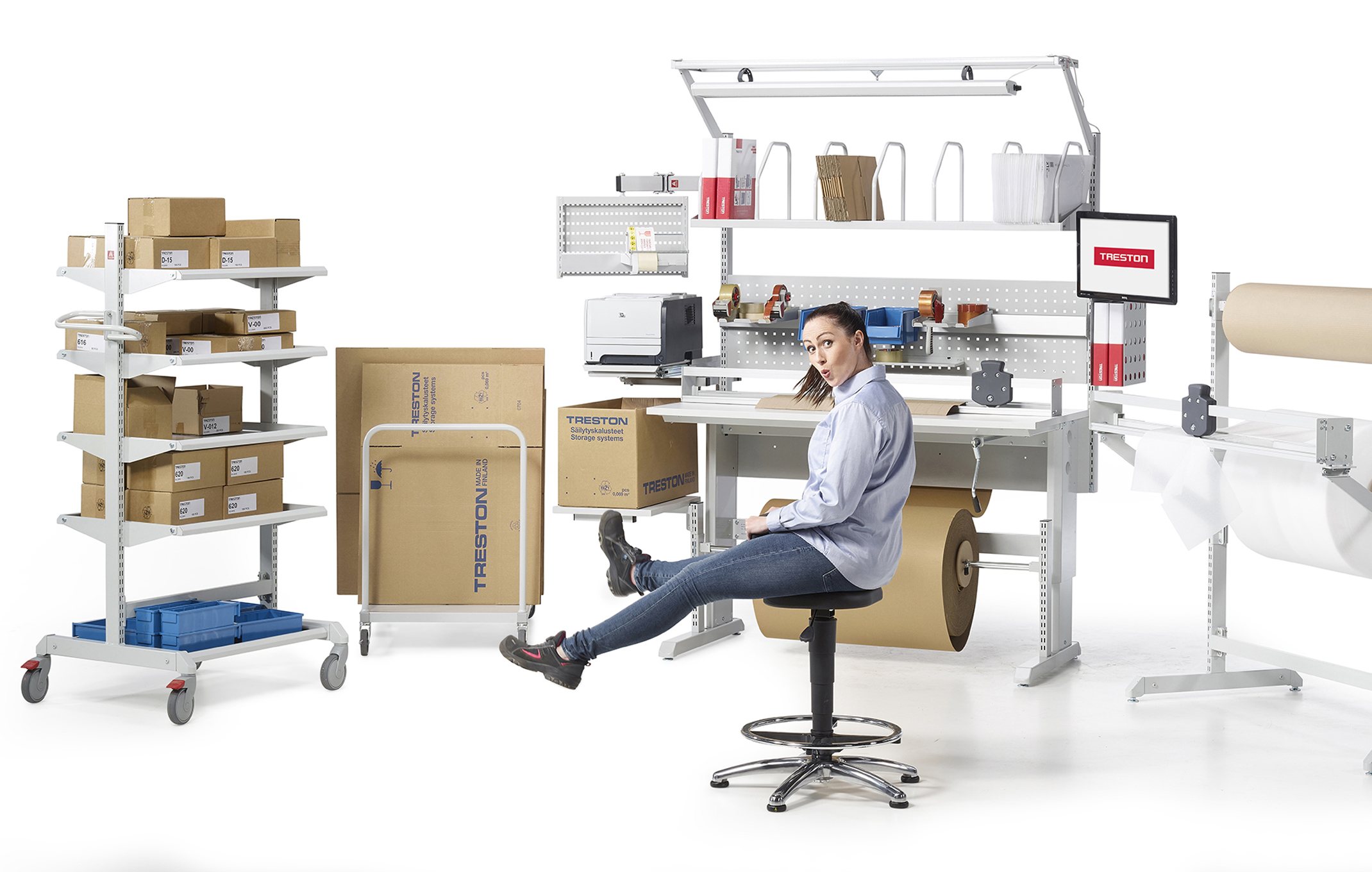 Treston packing and fulfilment workstation with carton shelves, roll holder and packing accessories