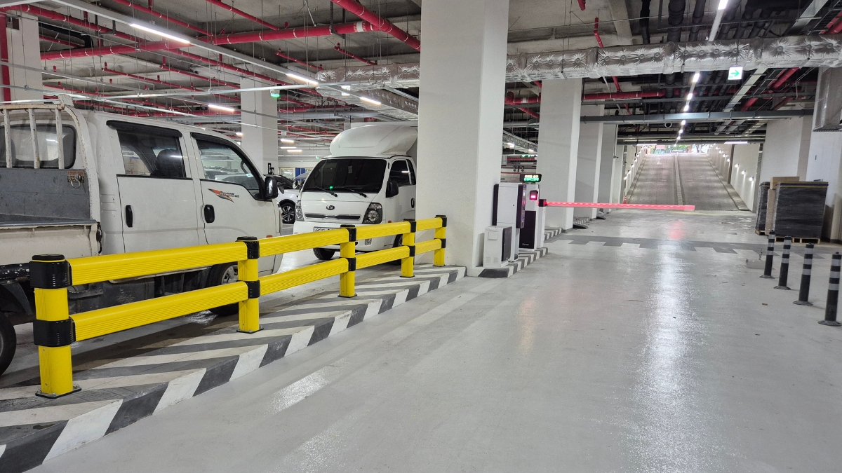 MPM parking barriers protecting a car park traffic route